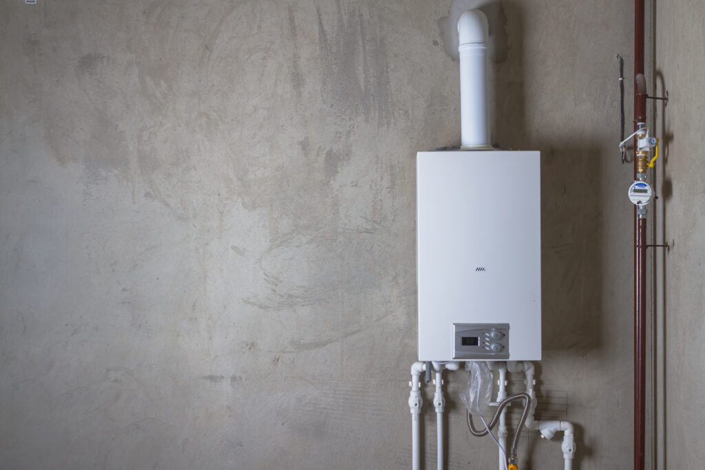 Double-circuit gas boiler in a new house basement